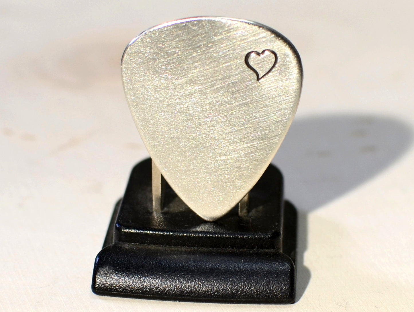Sterling silver guitar pick with love and a heart