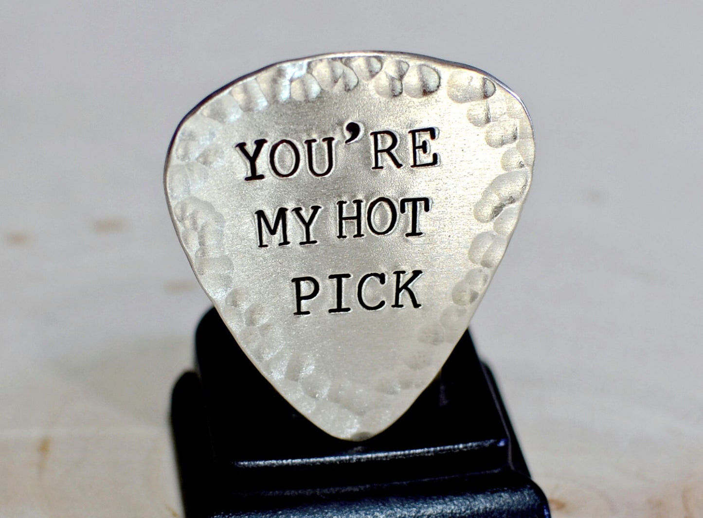 Guitar pick with hammered edges in your choice of metals