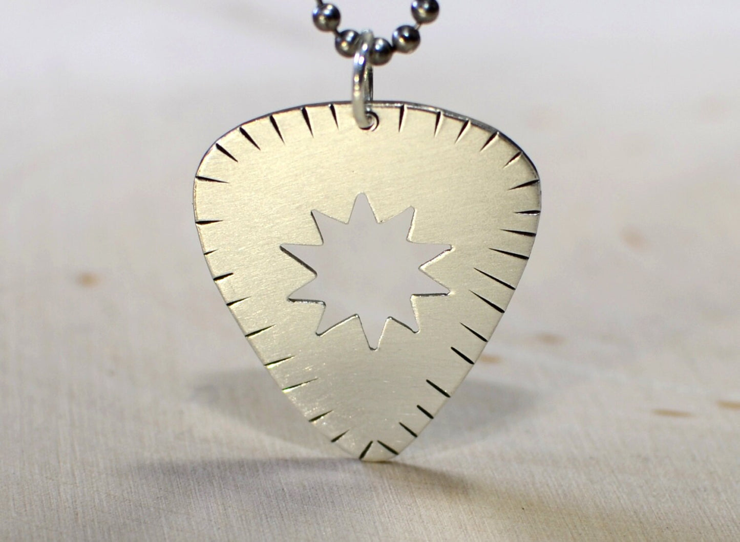 Sterling silver guitar pick necklace