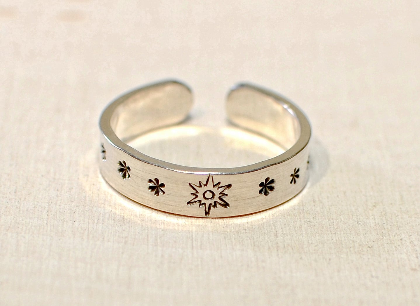 Sterling silver toe ring with sunburst and stars