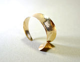 Hammered bronze cuff bracelet with anticlastic form and tapered curve, NiciArt 