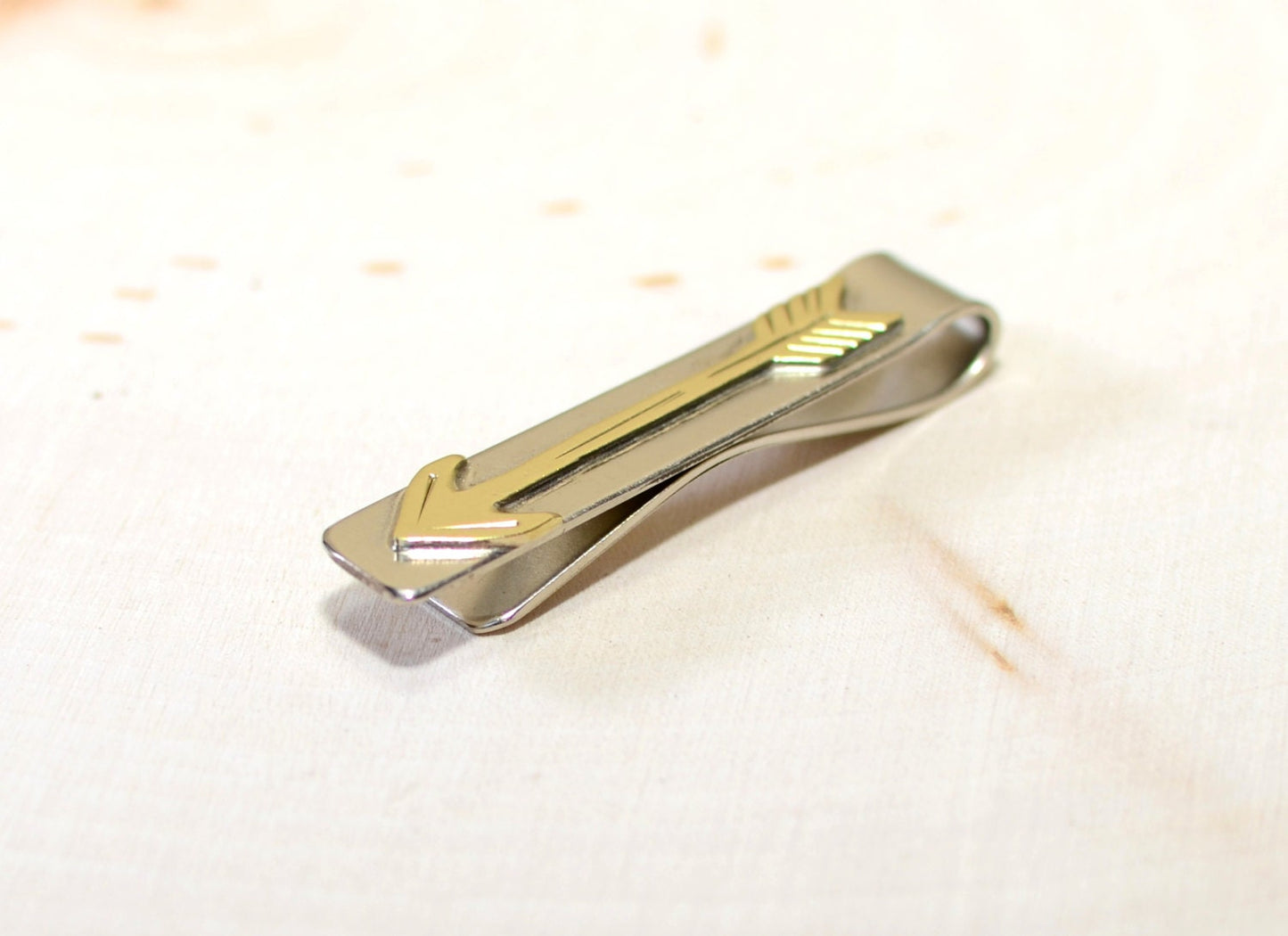 Brass arrow on sterling silver tie clip
