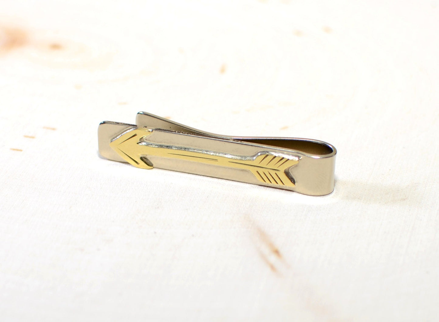Brass arrow on sterling silver tie clip