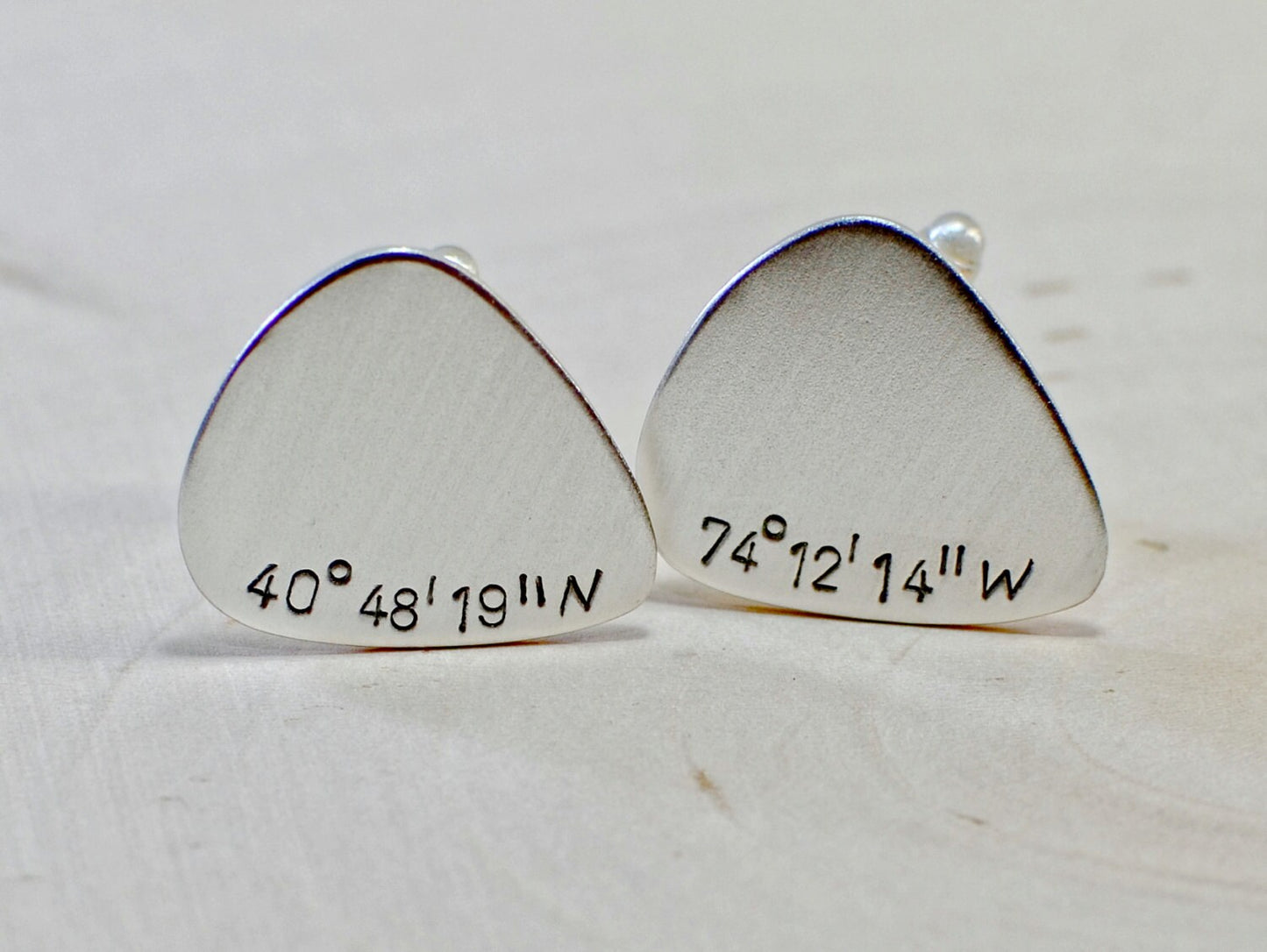 Sterling silver guitar pick cuff links with personalized latitude and longitude coordinates