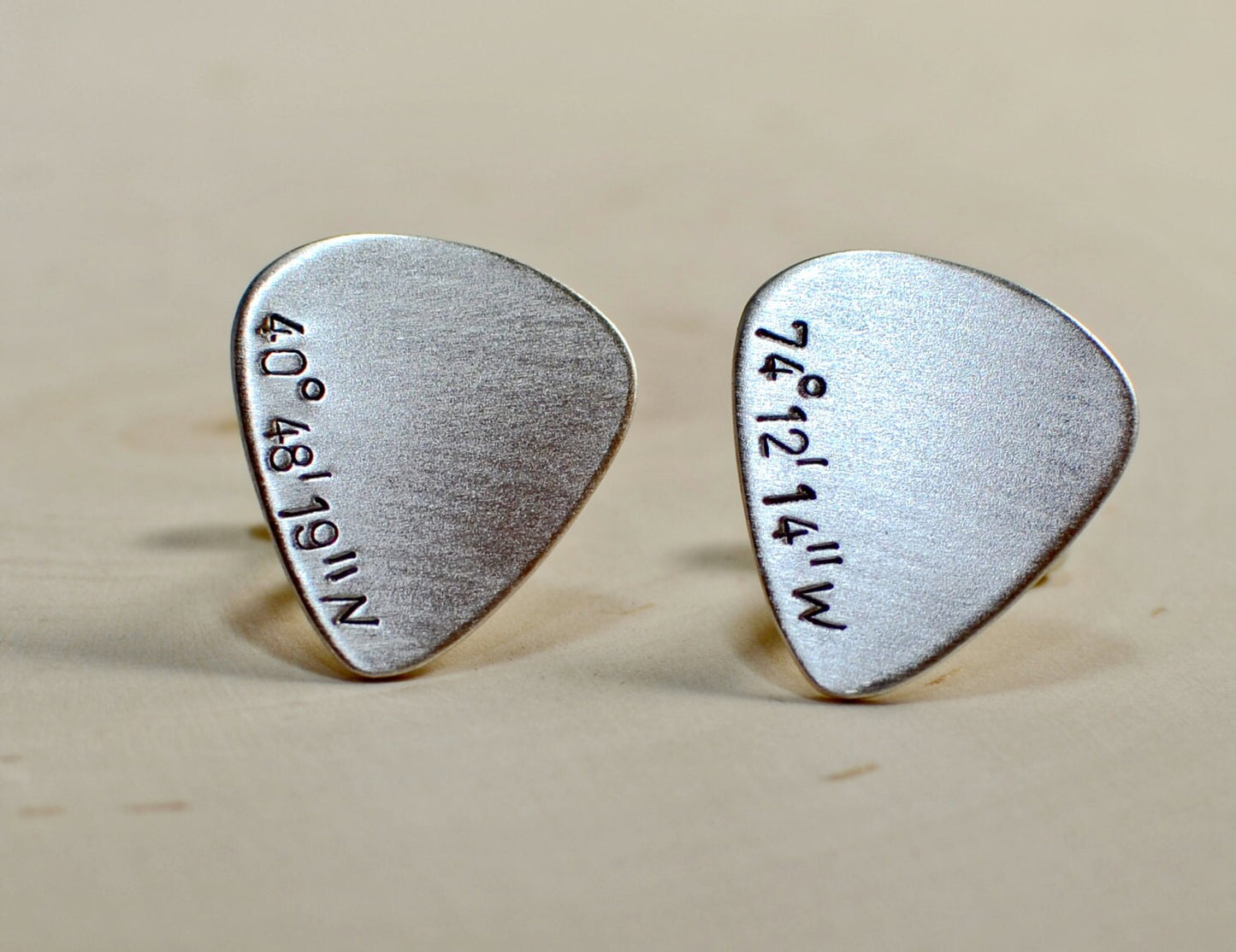 Sterling silver guitar pick cuff links with personalized latitude and longitude coordinates