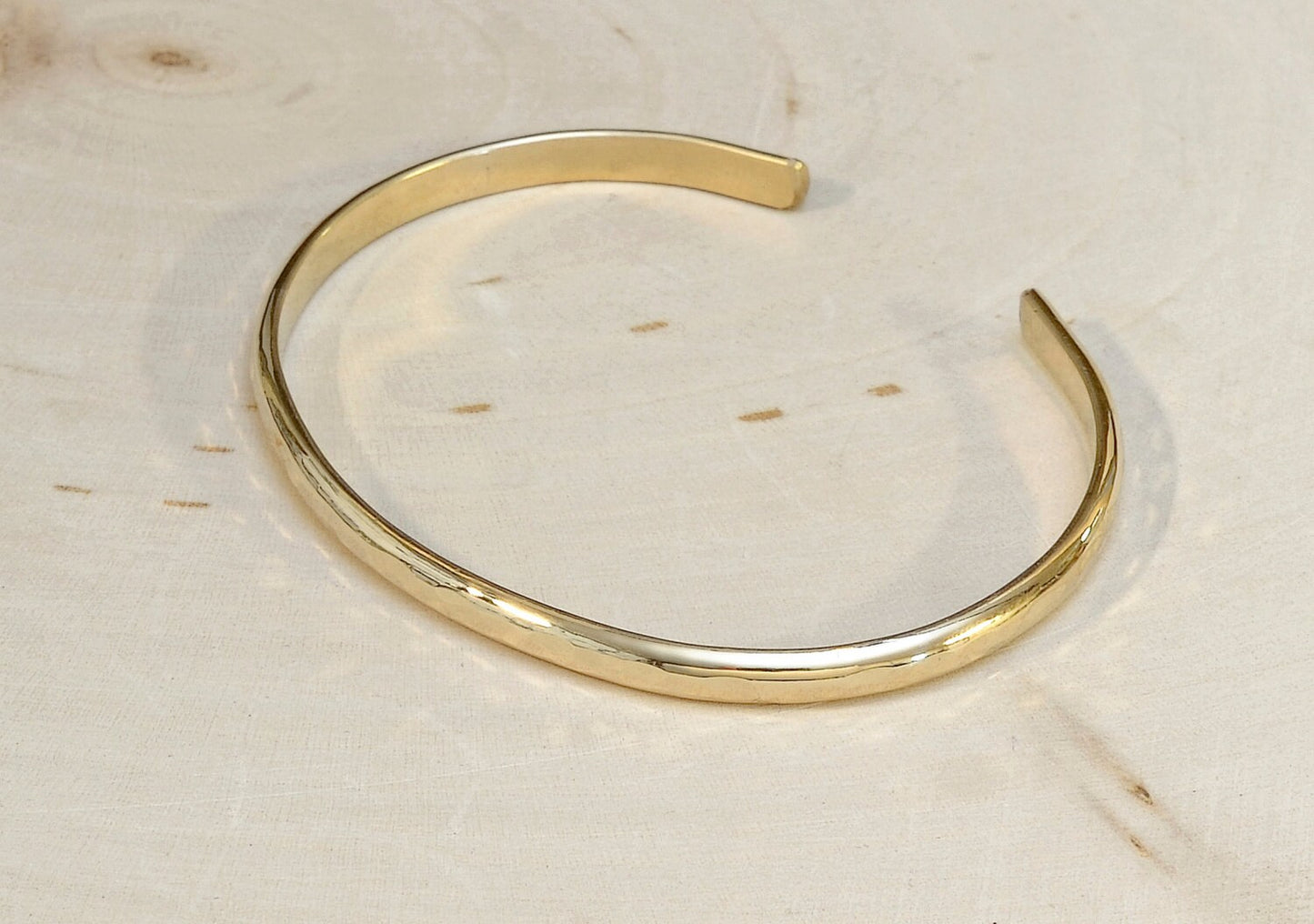 14k Gold hammered sleek cuff bracelet with mirror finish and dainty styling