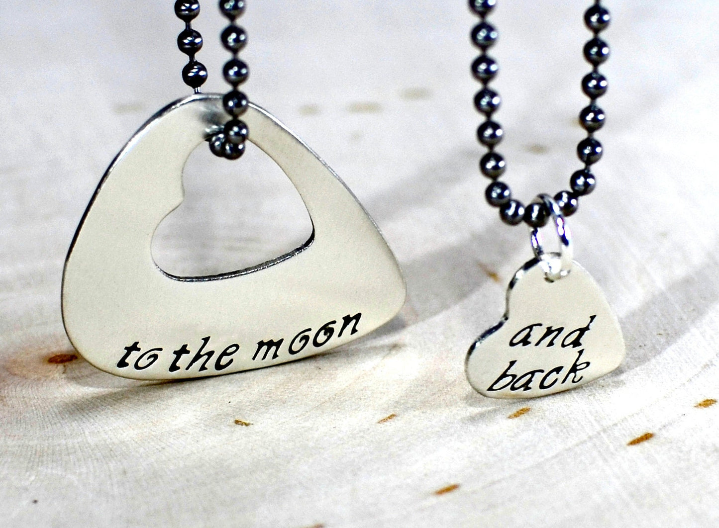 Sterling silver guitar pick couples necklace with love to the moon and back along with a heart