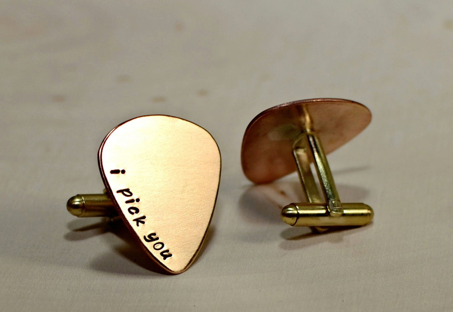 Bronze guitar pick cuff links engraved with I Pick You and wedding date