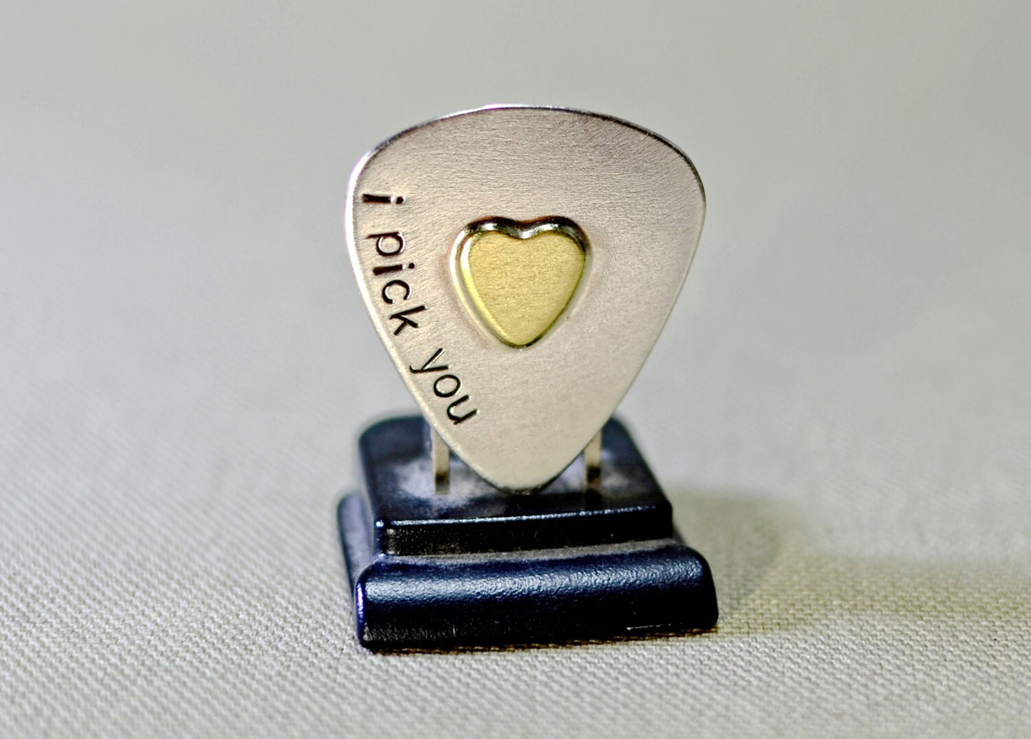 Sterling silver guitar pick and brass heart handcrafted with love