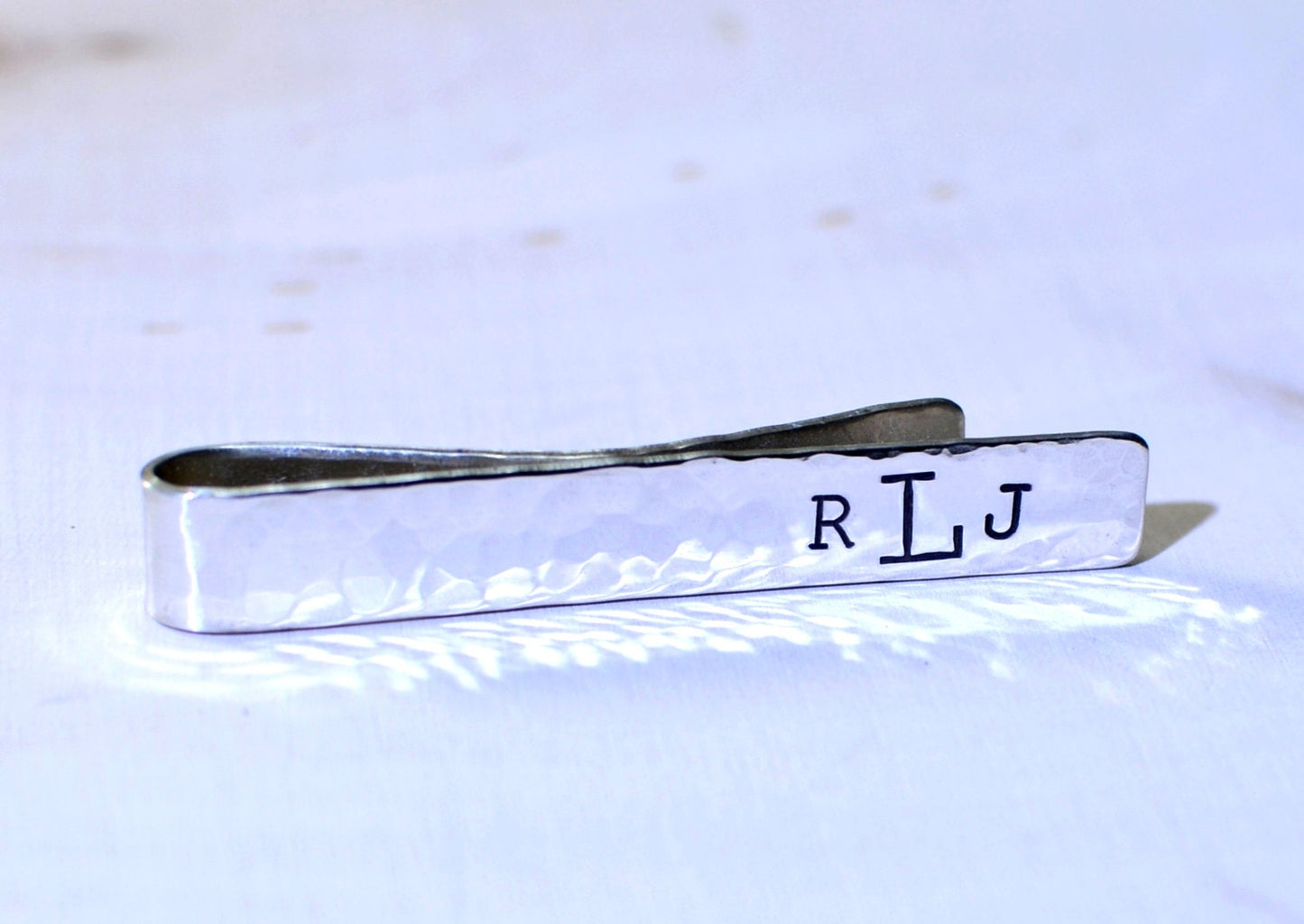 Hammered sterling silver tie clip with personalized monogram on tie bar