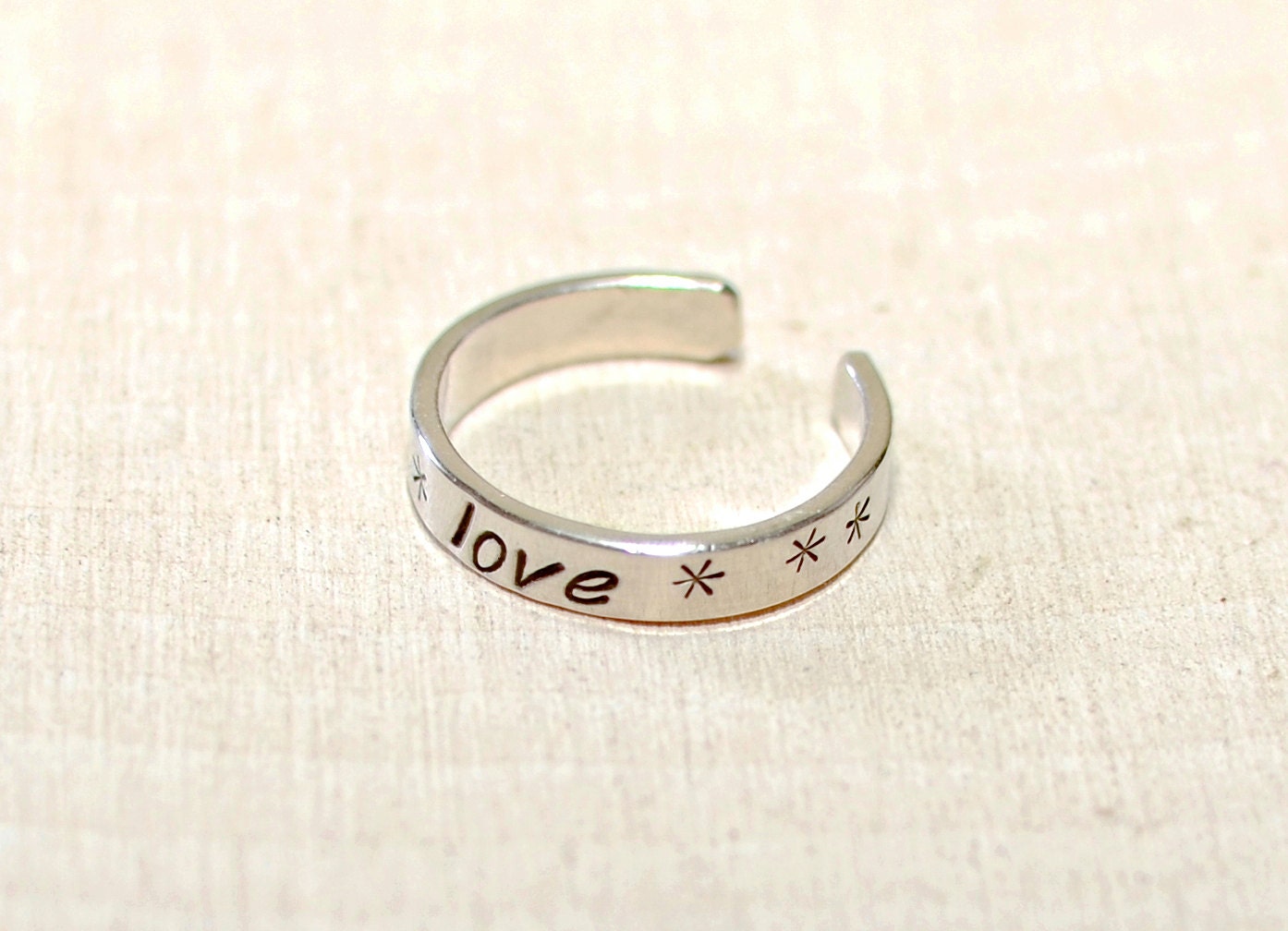 Narrow style dainty toe ring in sterling silver with love