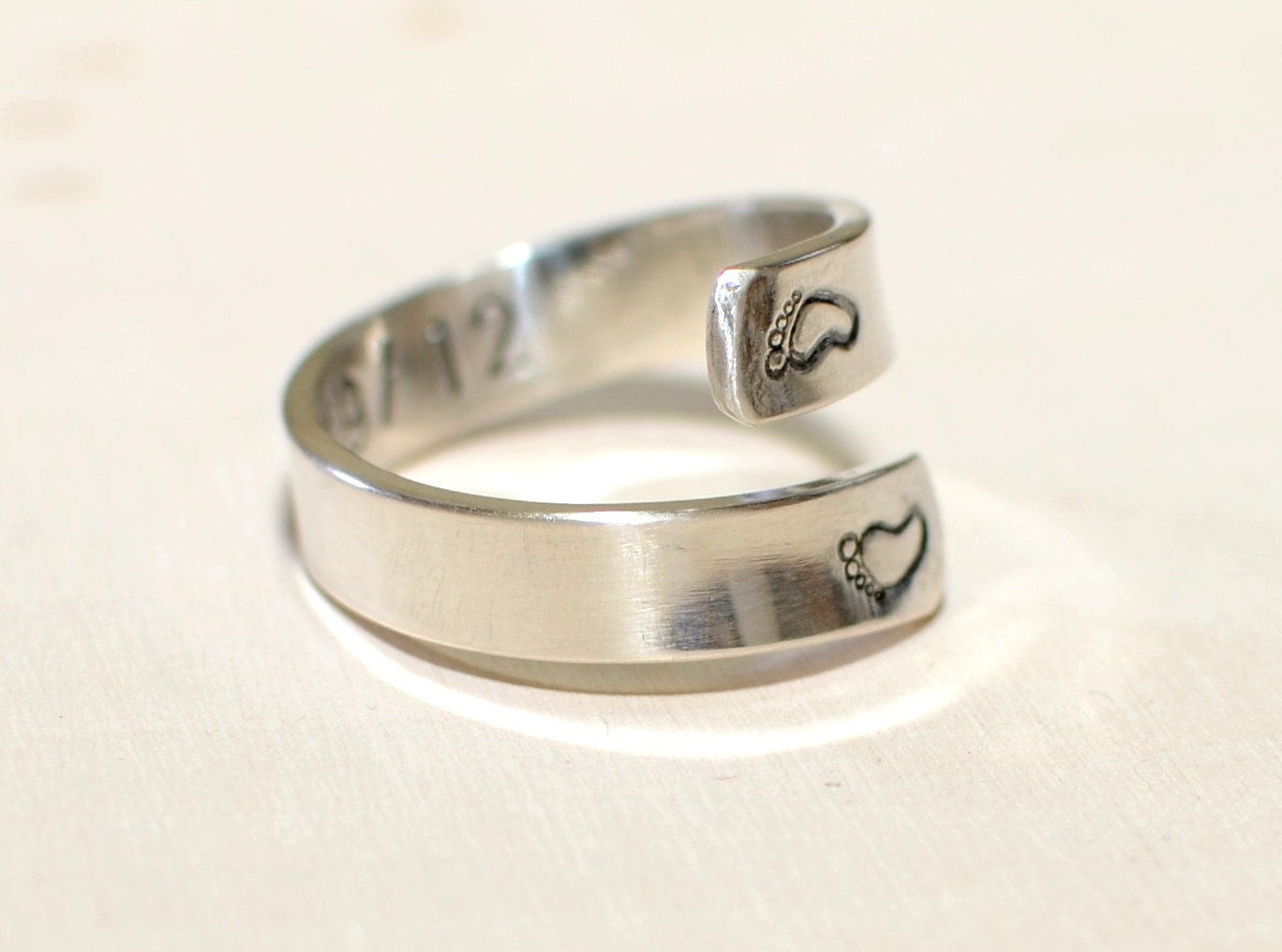 Sterling silver ring for a new mom with babyfeet and birth date