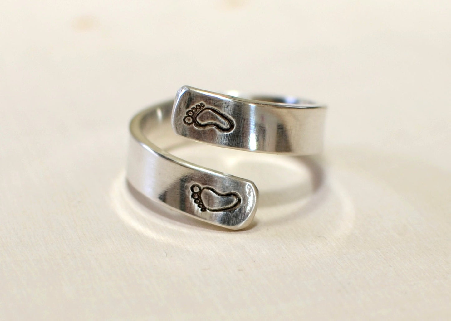 Sterling silver ring for a new mom with babyfeet and birth date