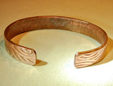 Copper cuff bracelet with hammered swirl design, NiciArt 