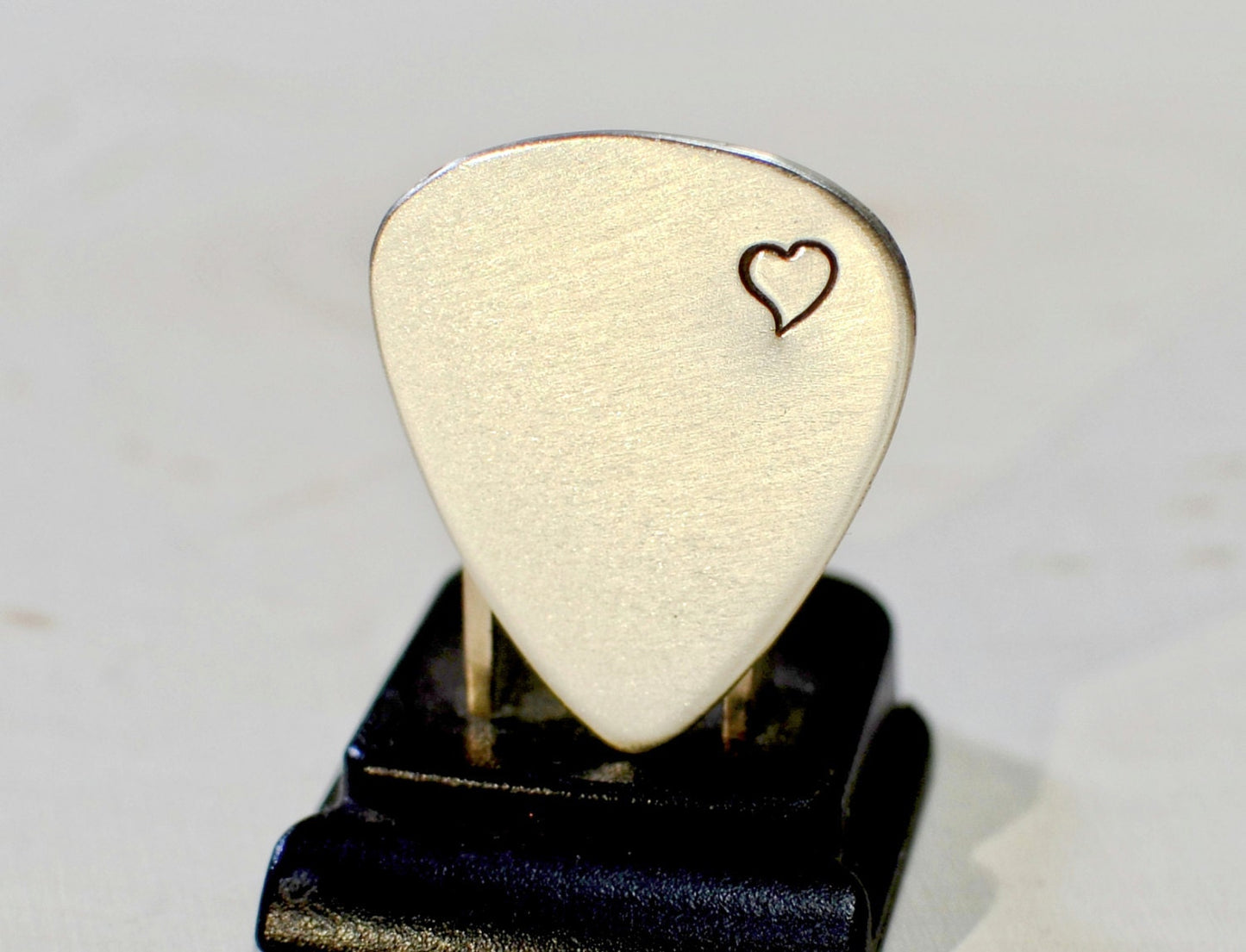 Sterling silver guitar pick with love and a heart