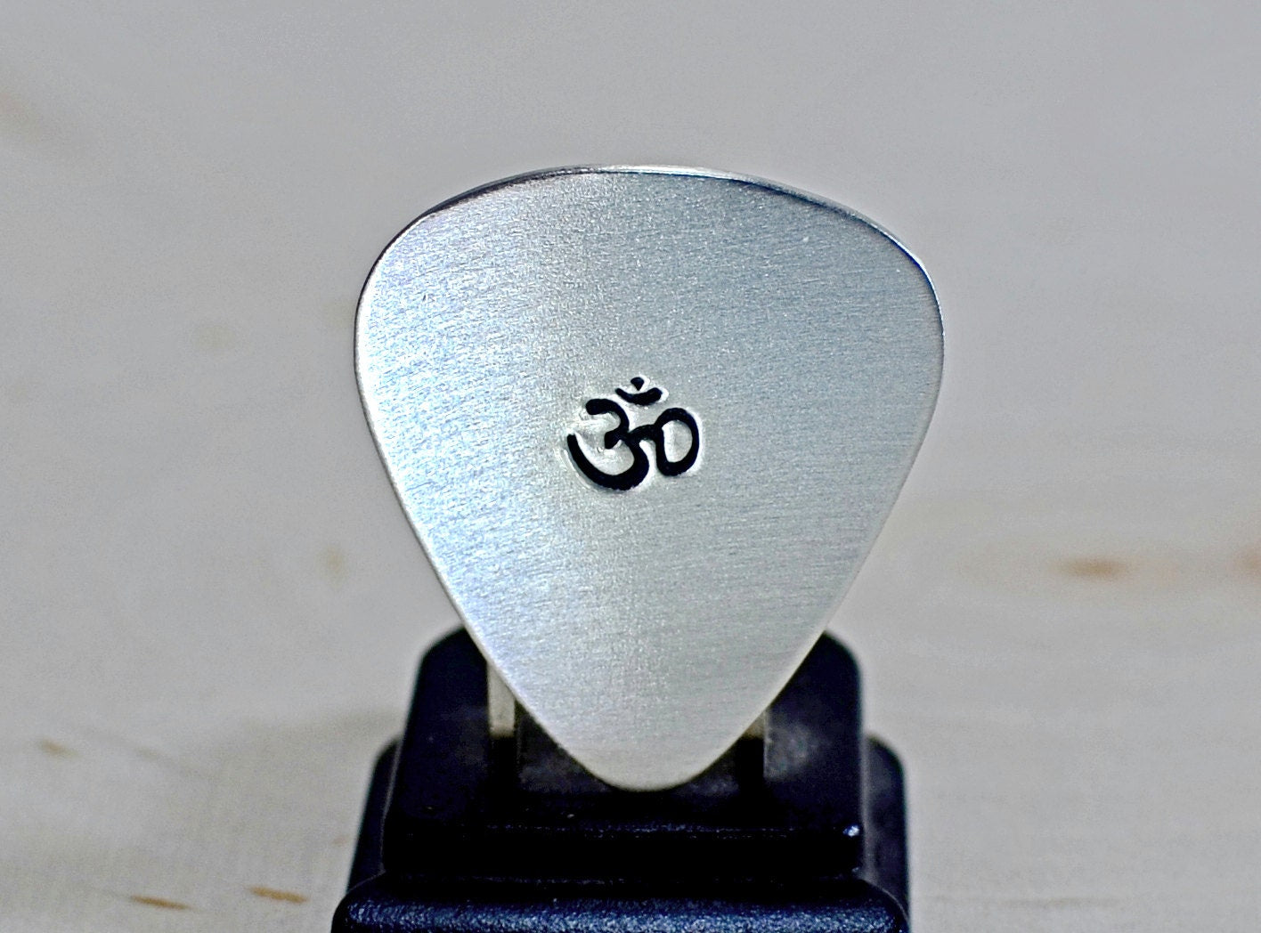 OM Sterling silver guitar pick