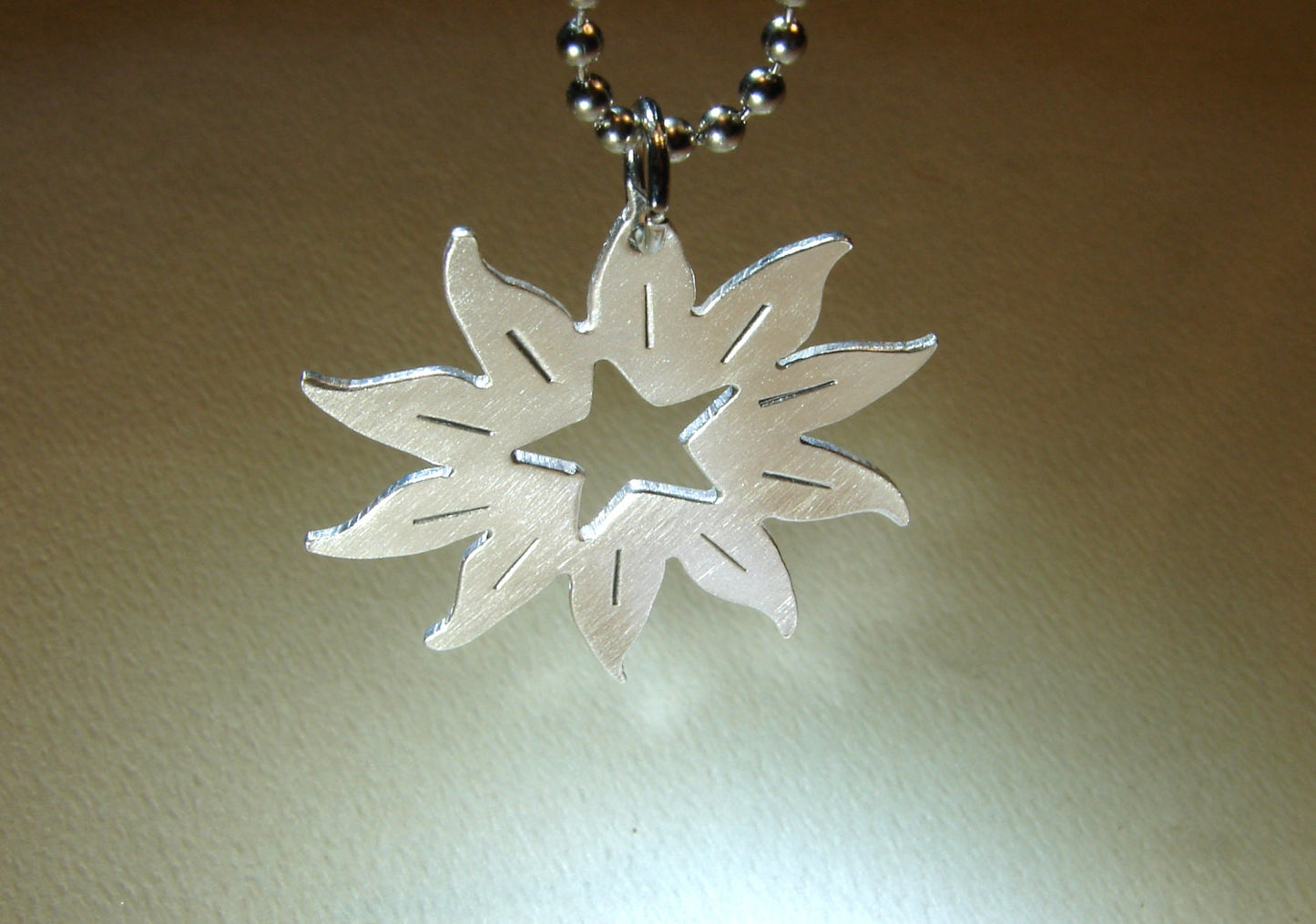 Sterling silver sun with a star handcrafted artistic necklace