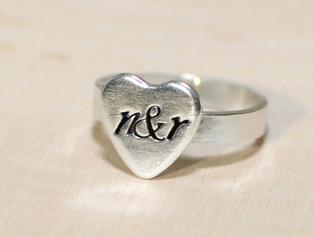 Heart ring with sterling silver band and personalized heart