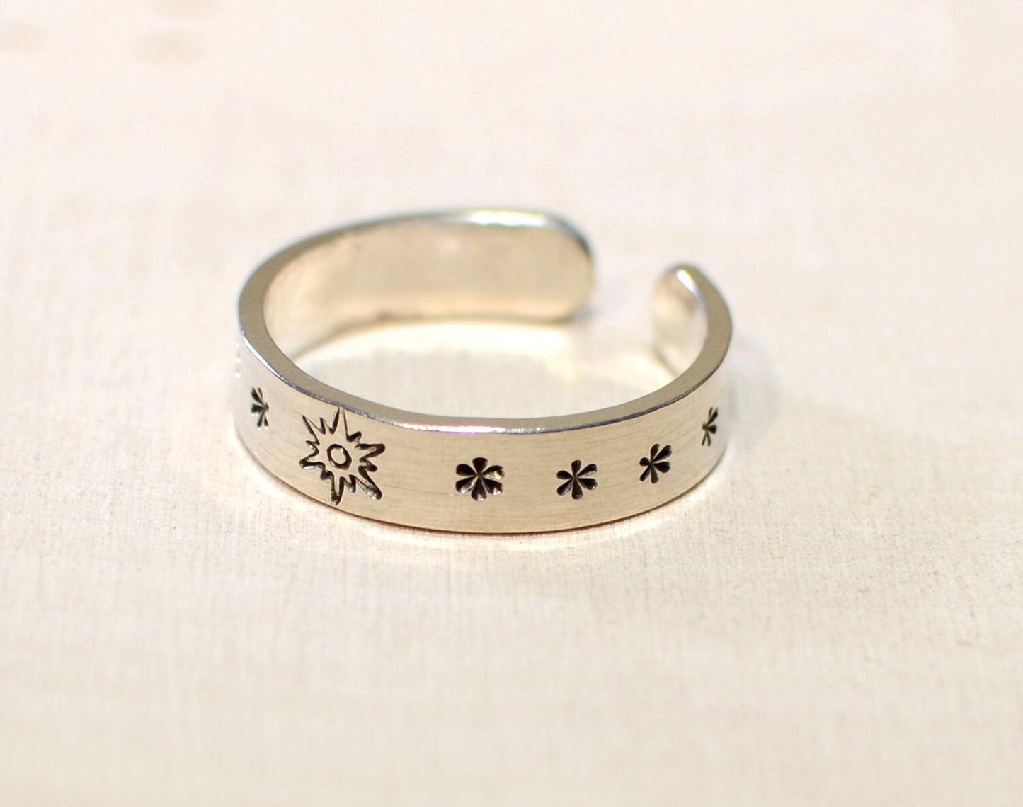 Sterling silver toe ring with sunburst and stars