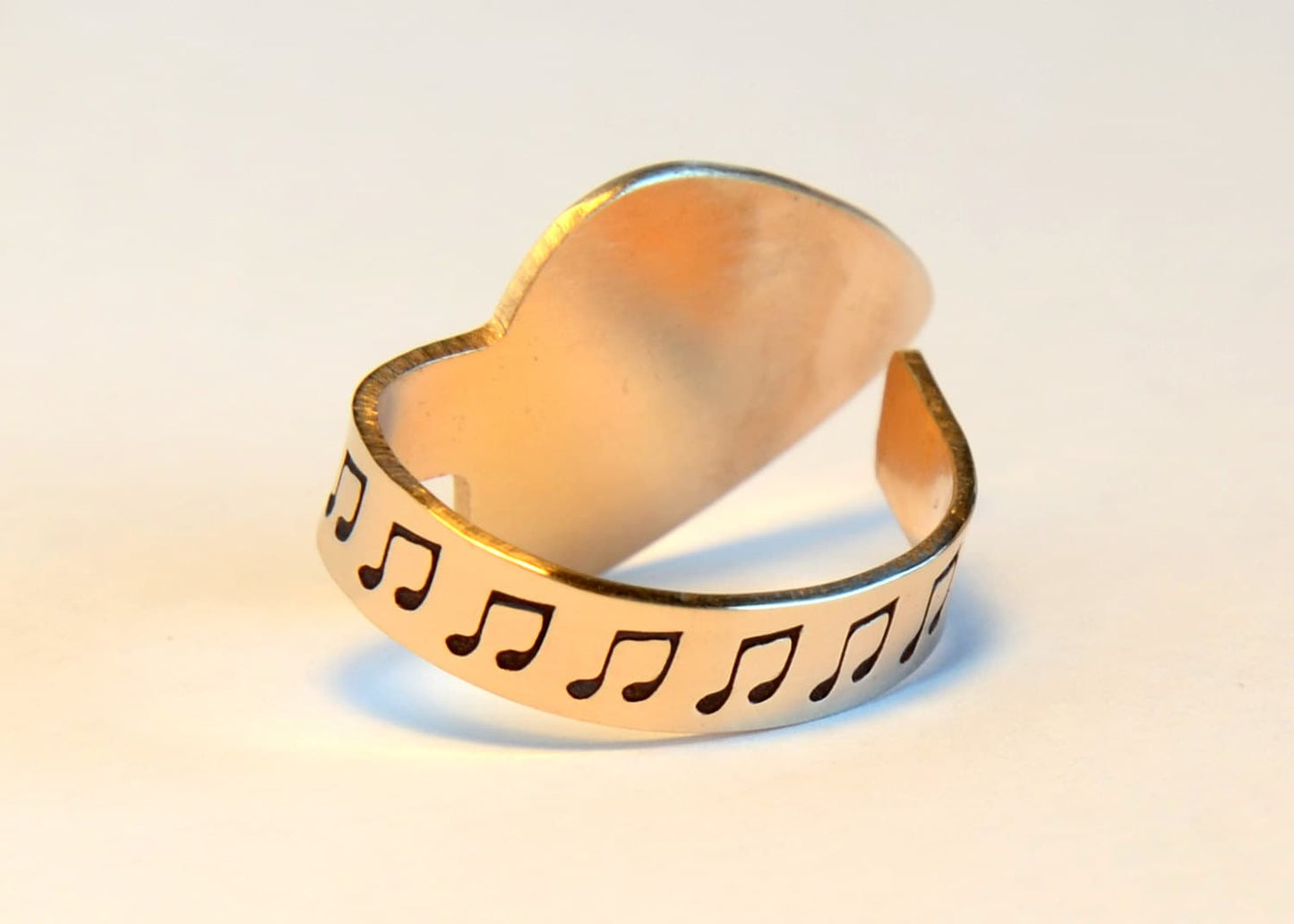 Bronze thumb guitar pick with I pick you