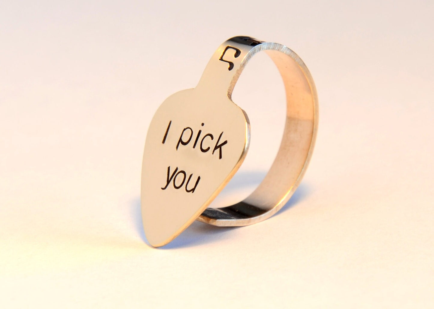 Bronze thumb guitar pick with I pick you