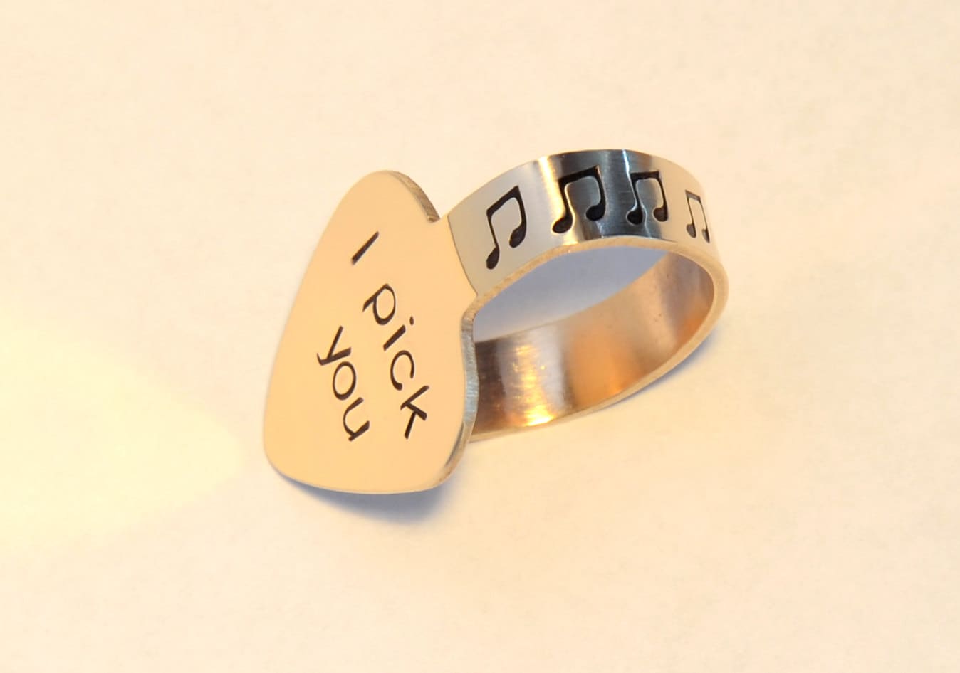 Bronze thumb guitar pick with I pick you