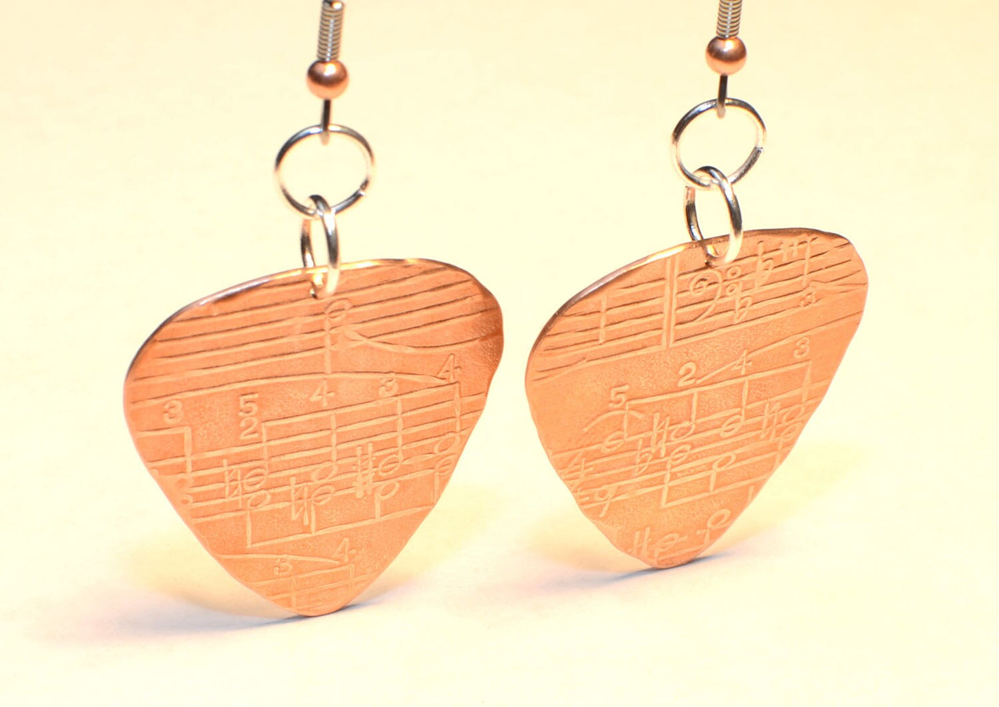 Copper guitar pick dangle earrings with musical notes