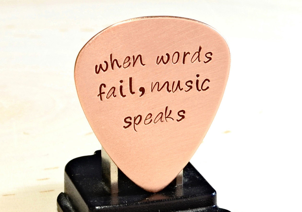 When Words Fail Music Speaks copper guitar pick