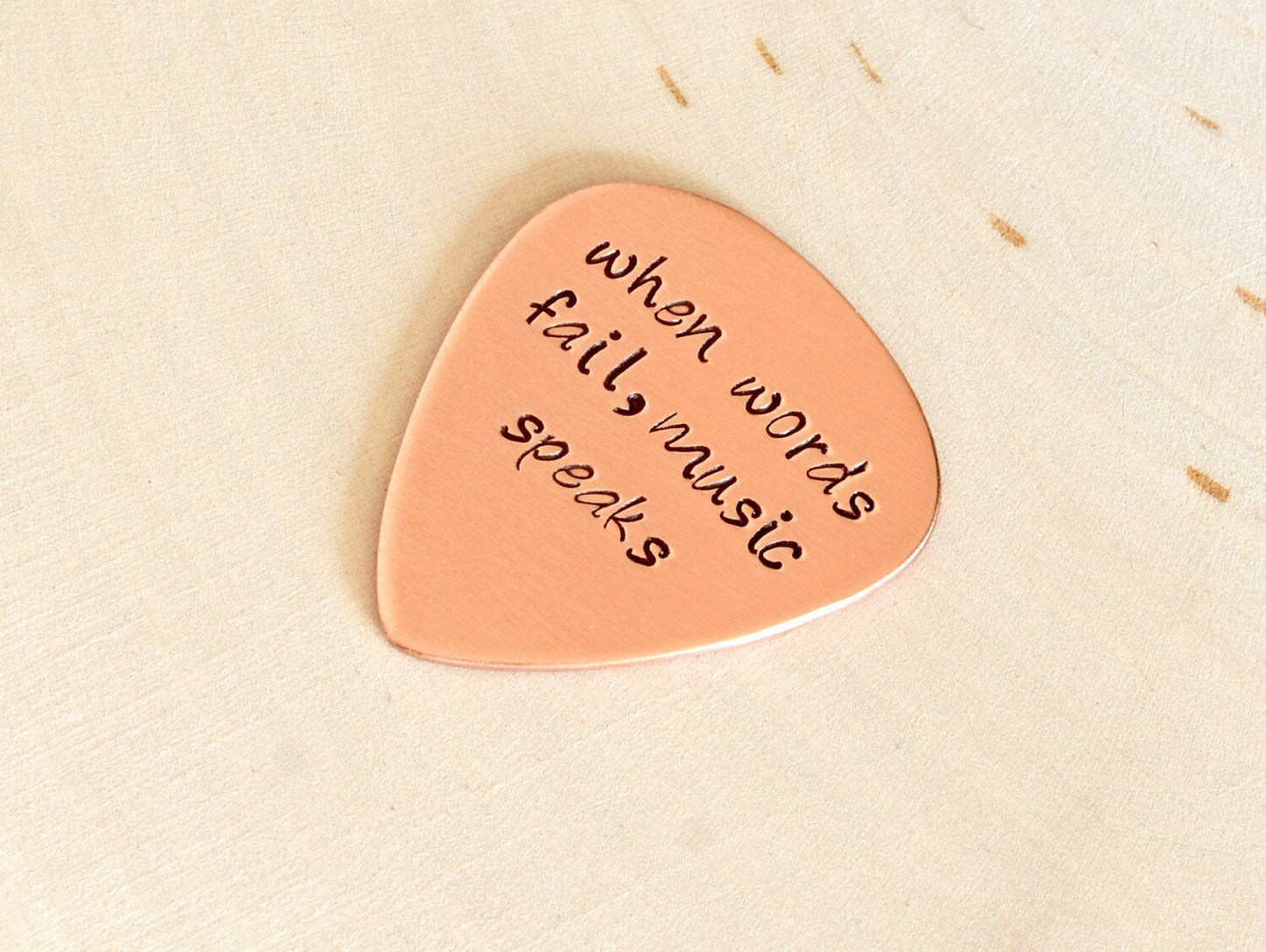 When Words Fail Music Speaks copper guitar pick