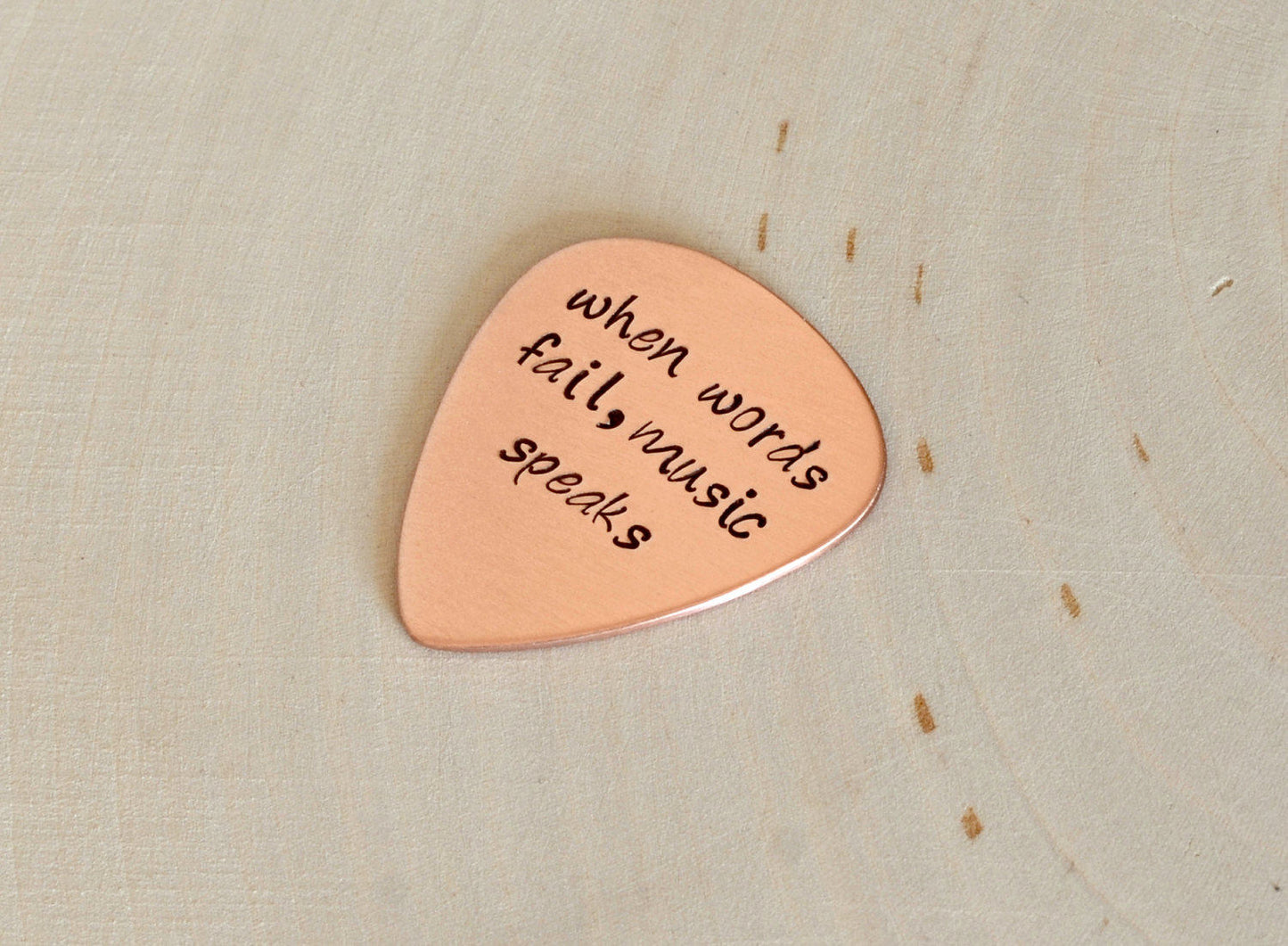 When Words Fail Music Speaks copper guitar pick