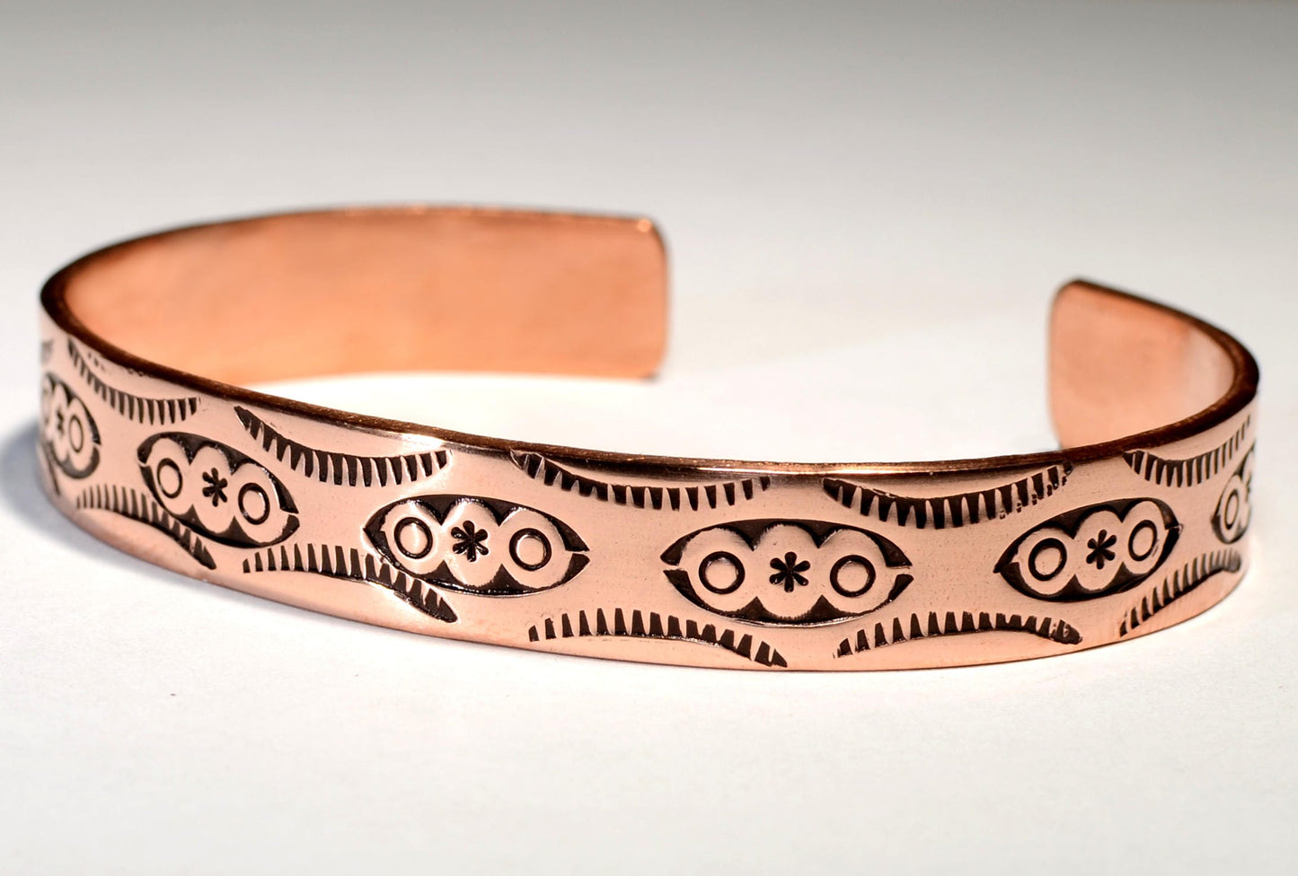 Copper cuff bracelet imprinted with Native American Handmade Metal Stamps