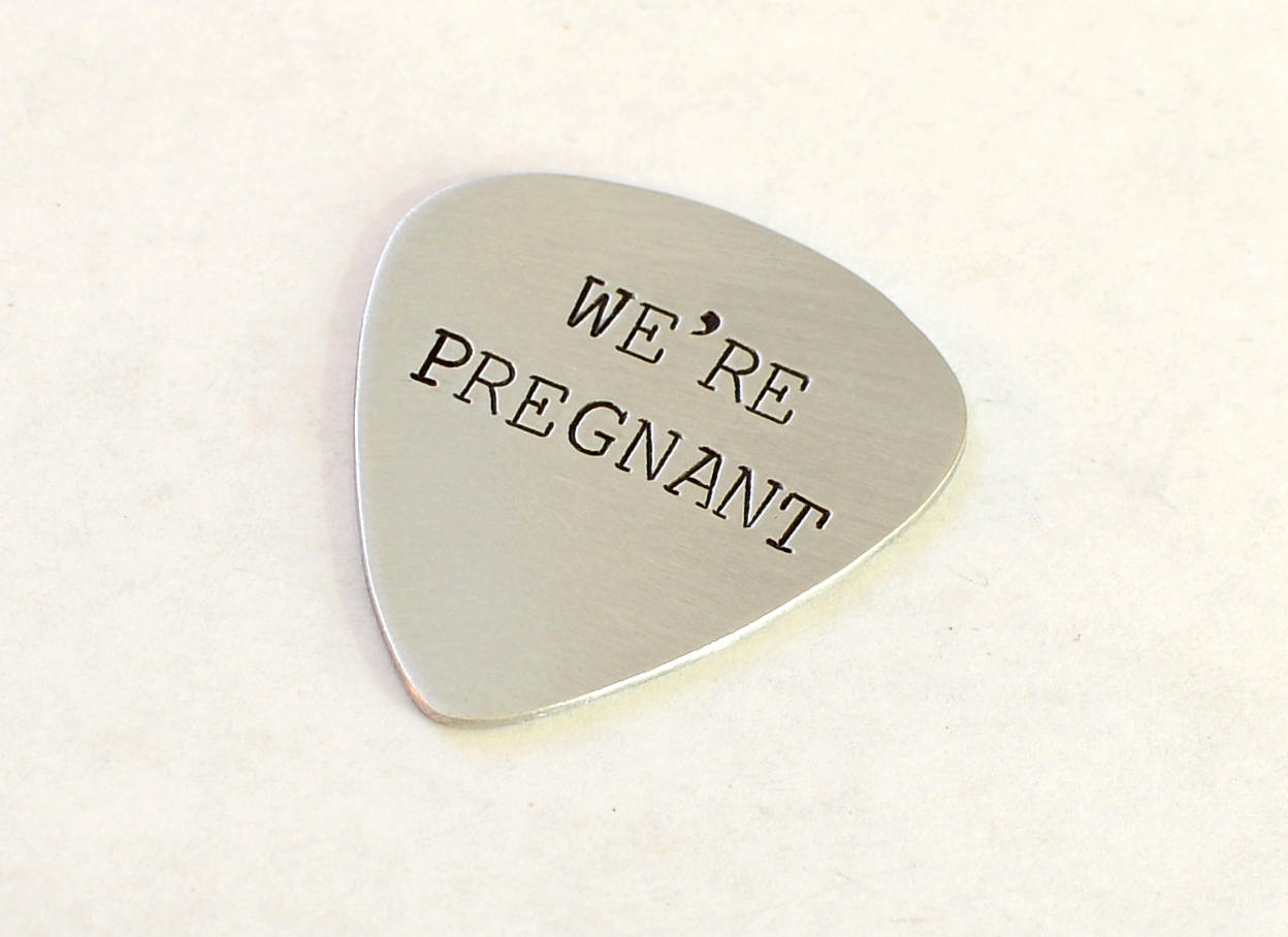 We’re Pregnant Guitar Pick for a Rocking Surprise in your choice of metals