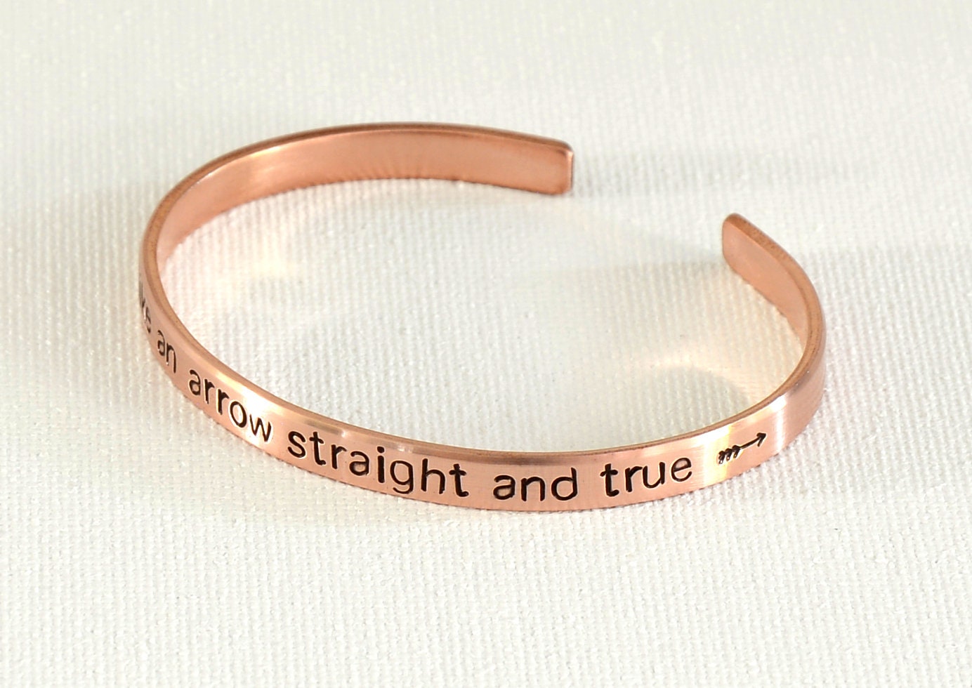 Fly like an arrow straight and true copper bracelet