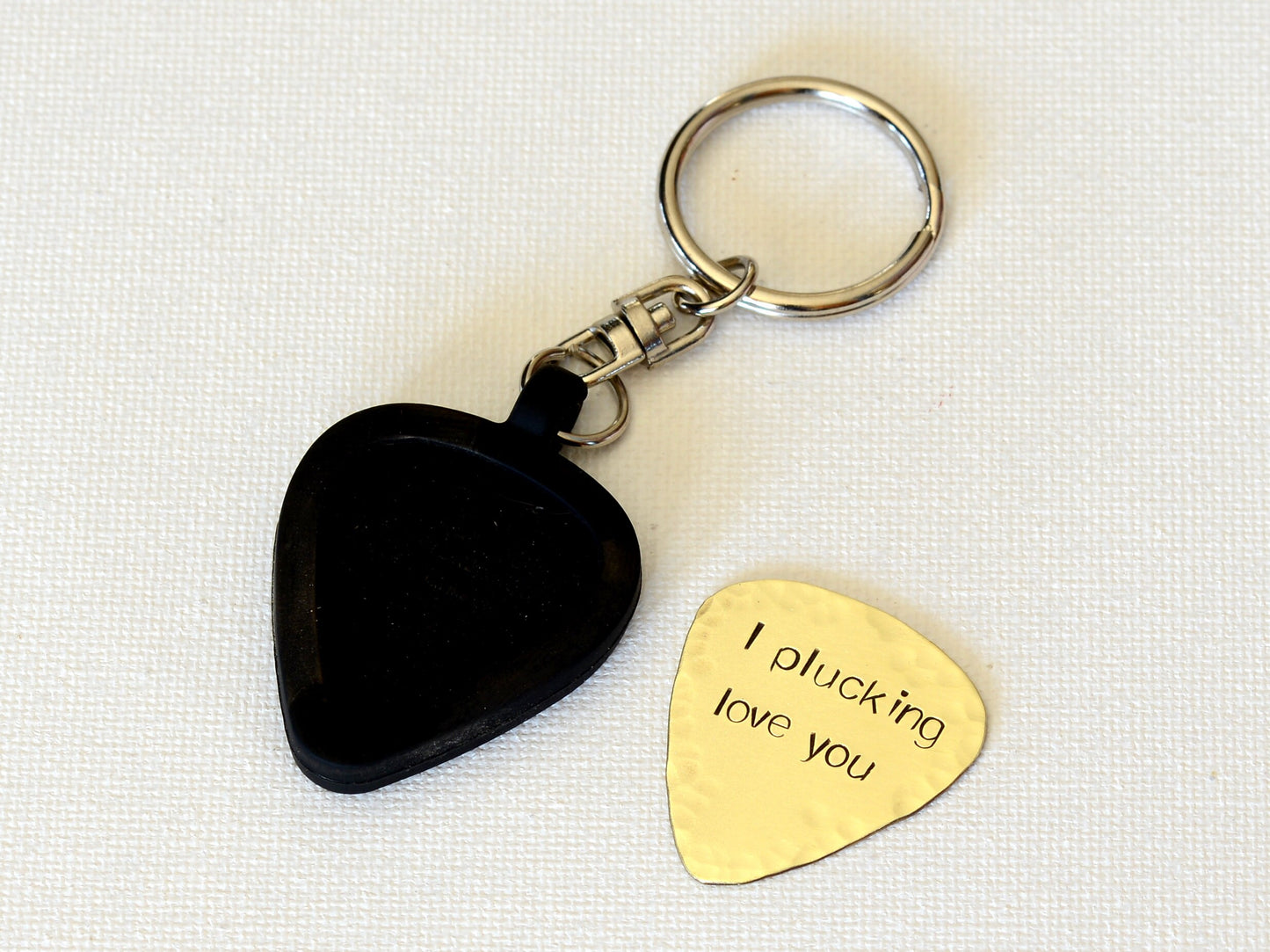 Brass guitar pick keychain with rubber holder