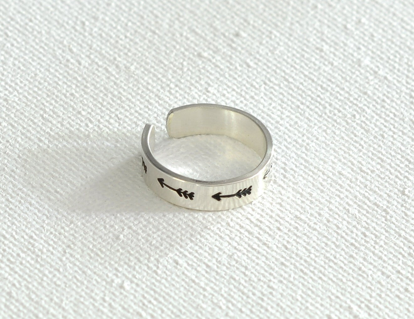 Sterling silver toe ring with arrows on narrow 925 adjustable band