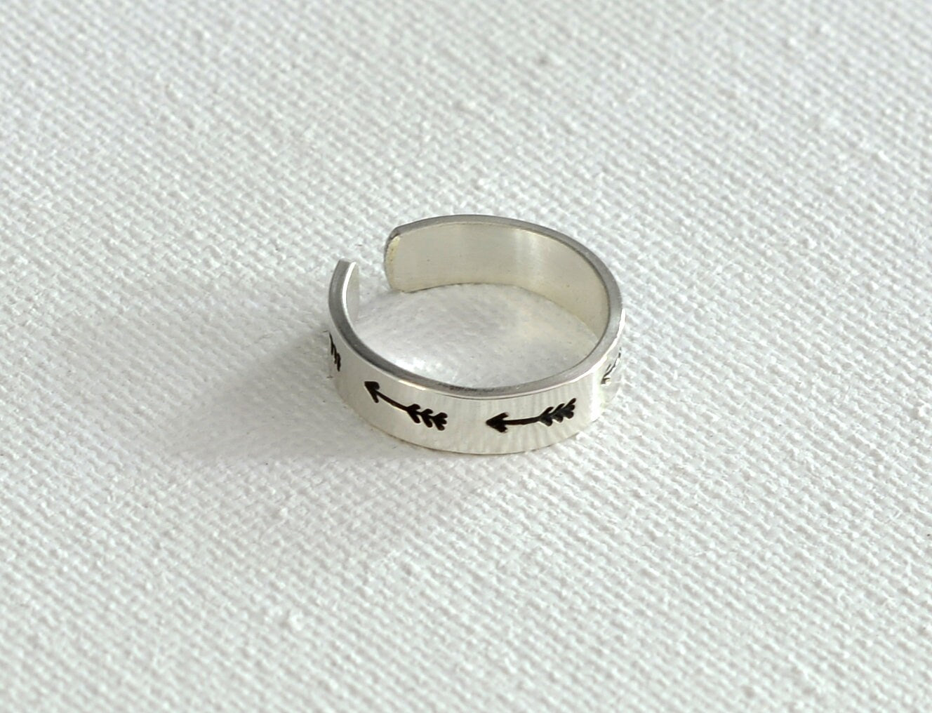 Sterling silver toe ring with arrows on narrow 925 adjustable band