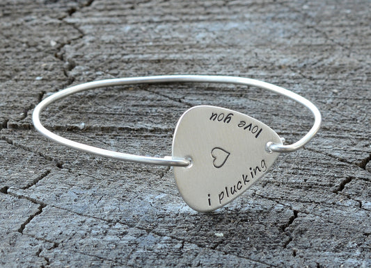 I plucking love you guitar pick set in a sterling silver tension bangle