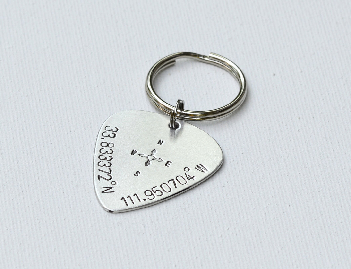 Guitar Pick with Personalized Latitude Longitude Coordinates on a keychain