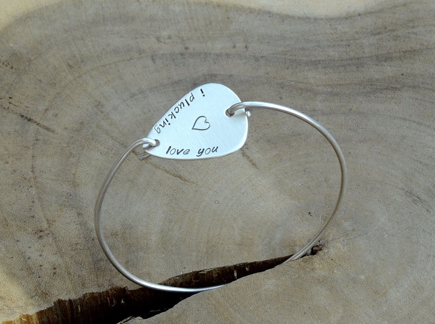 I plucking love you guitar pick set in a sterling silver tension bangle