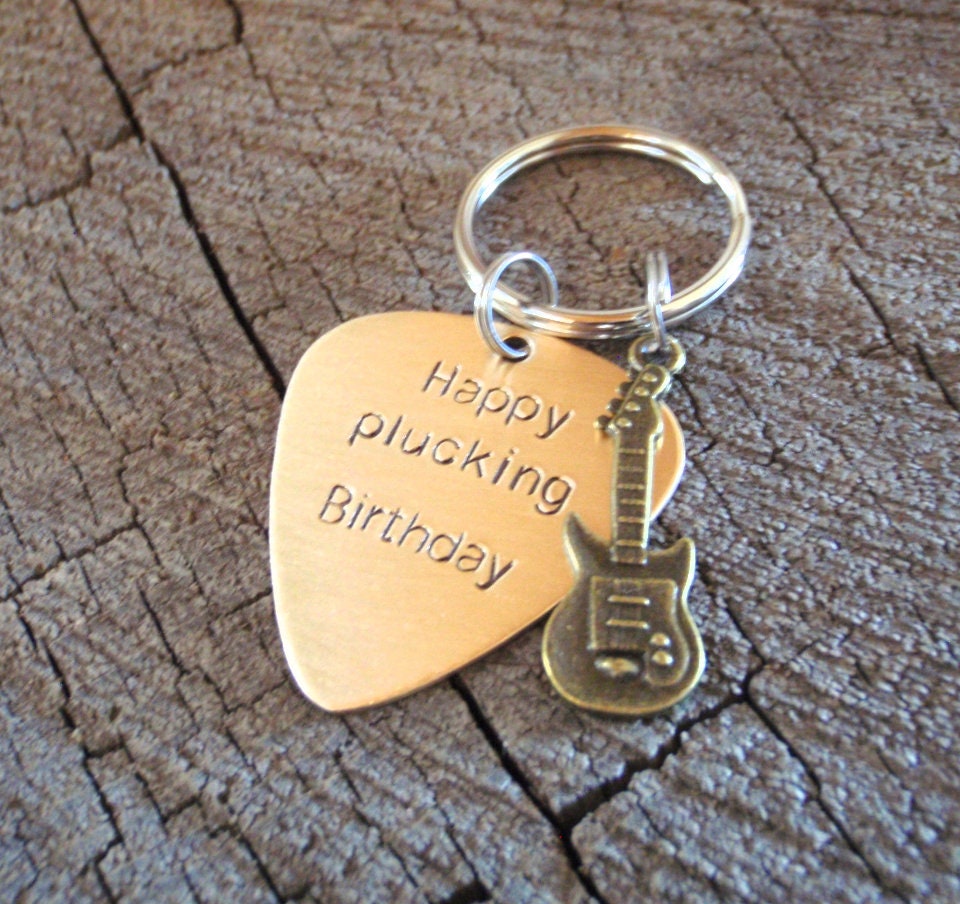 Guitar themed keychain based on a bronze guitar pick and a small brass guitar charm