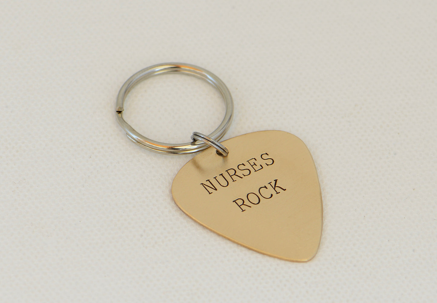 Nurses Rock Guitar Pick Keychain in Bronze