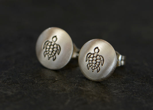 Button style earrings with sea turtle designs in sterling silver