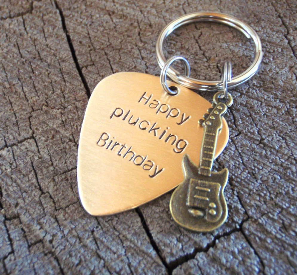 Guitar themed keychain based on a bronze guitar pick and a small brass guitar charm