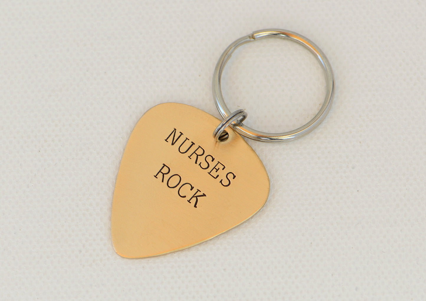 Nurses Rock Guitar Pick Keychain in Bronze
