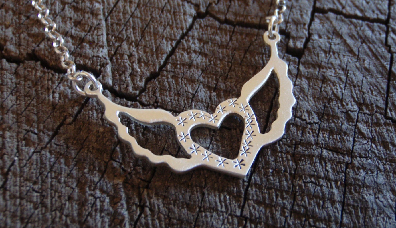 Sterling silver winged heart necklace