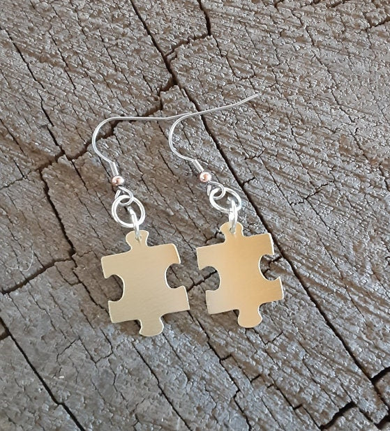 Puzzle piece design brass earrings