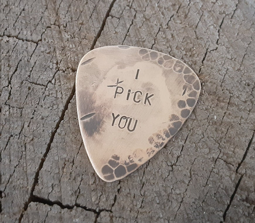 I pick you on a distressed bronze guitar pick