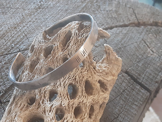 Men's bronze anniversary cuff bracelet with tally marks