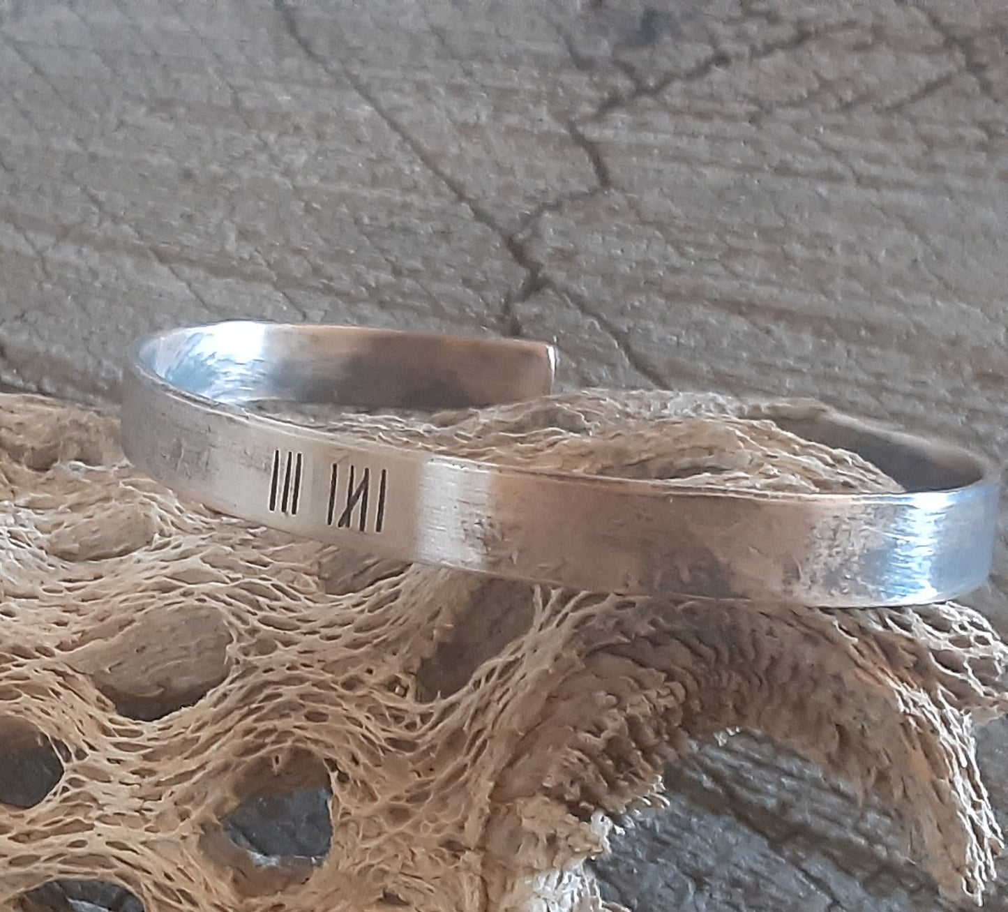 Men's bronze anniversary cuff bracelet with tally marks