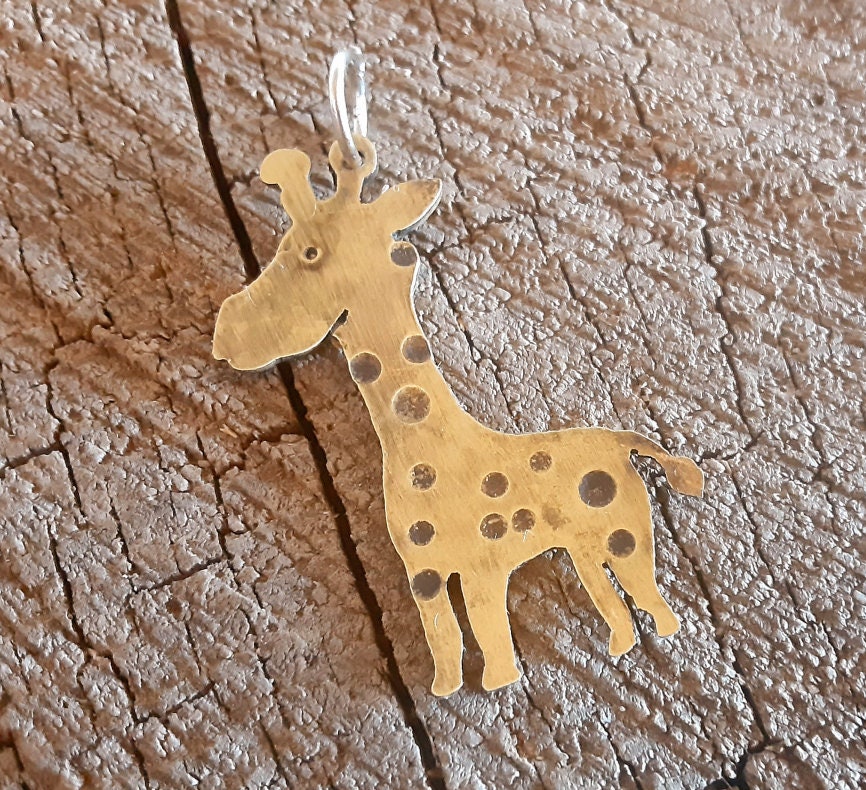 Handcrafted custom girrafe in brass to create a pendant necklace